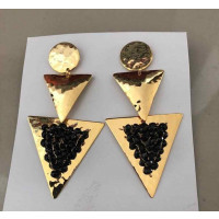 BRONCO ARETES WITH 18K GOLD BATHROOM